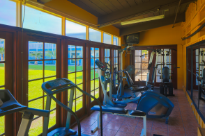 fitness room overlooking grassy area